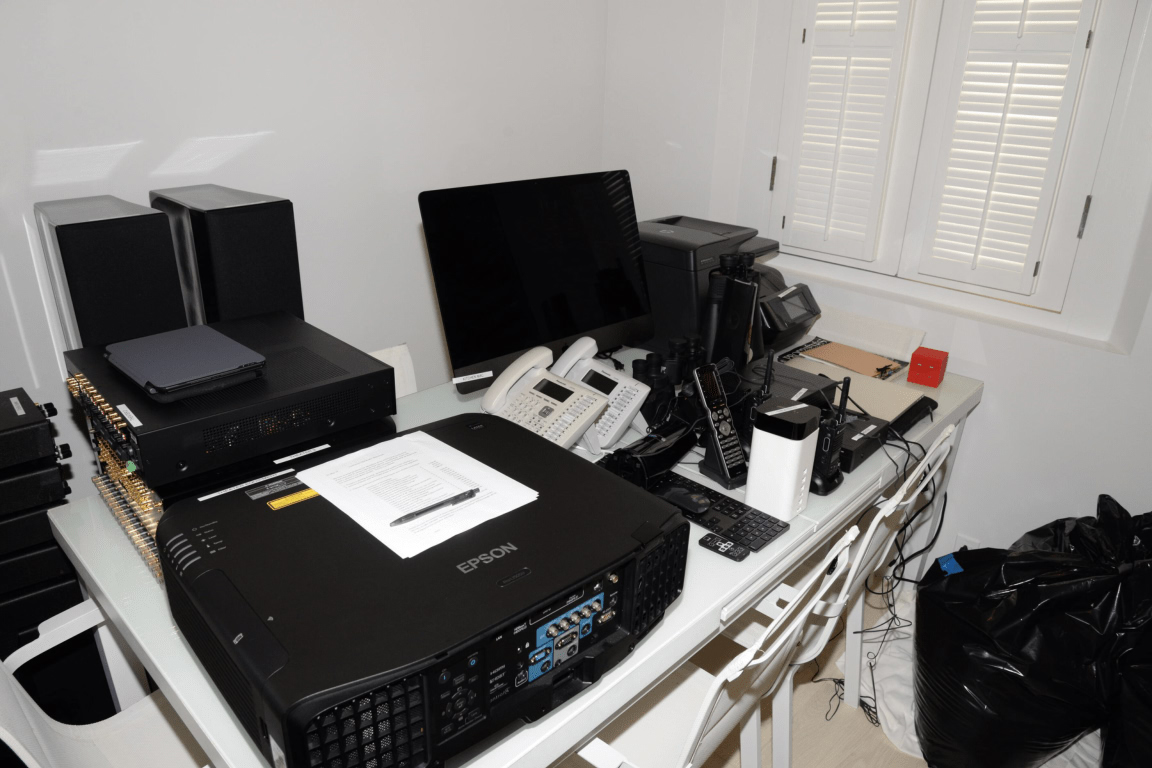 A busy office desk with a computer monitor