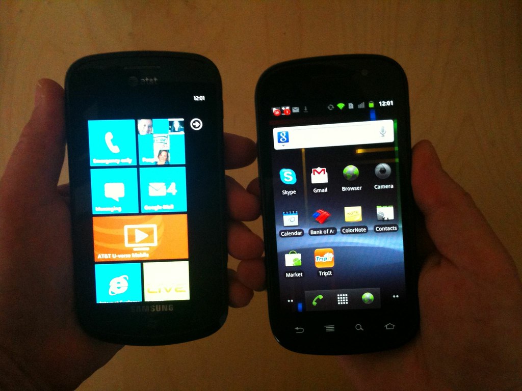 Two smartphones held side by side
