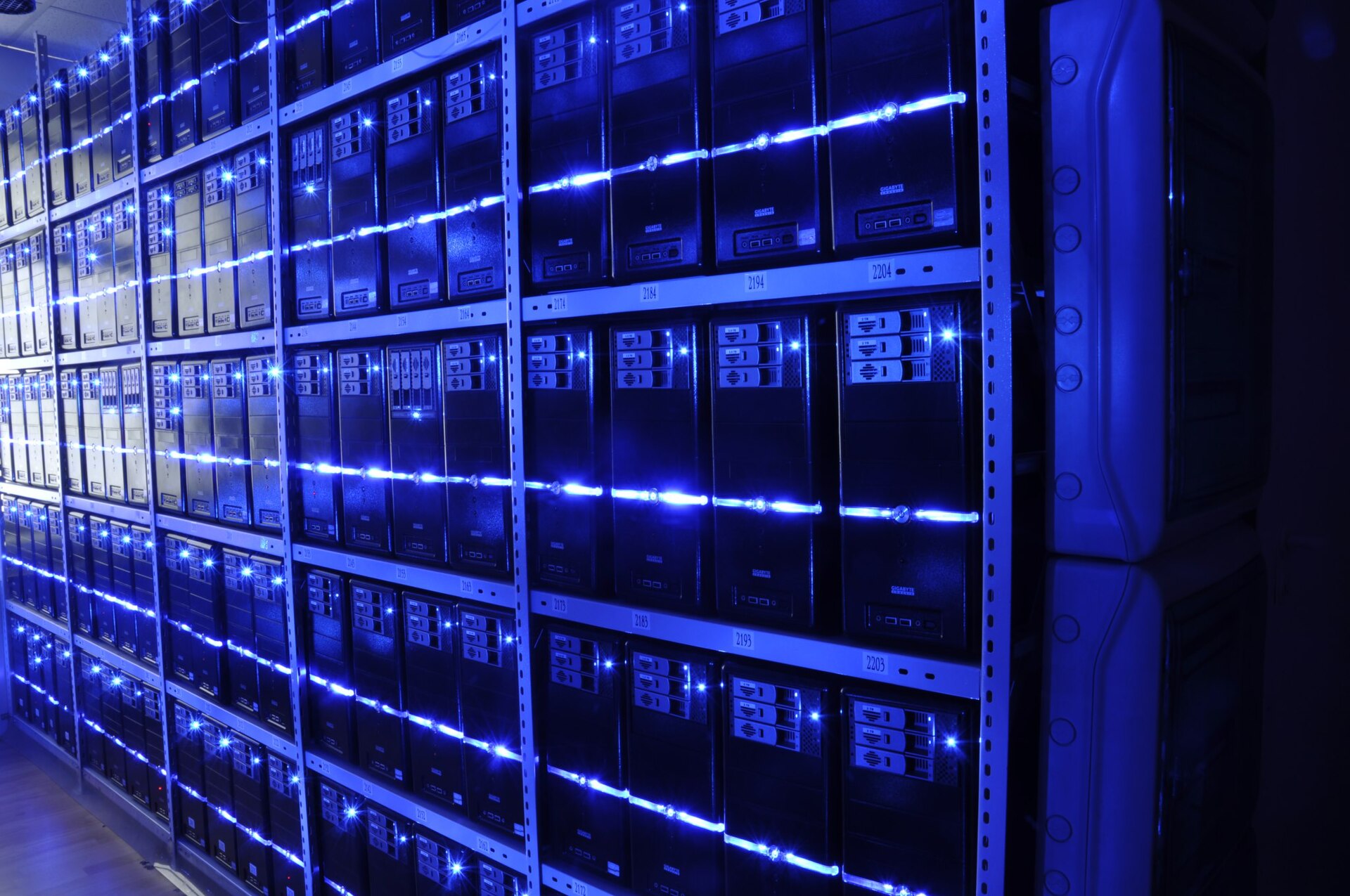 Server room with rows of networking equipment, representing enterprise cloud security