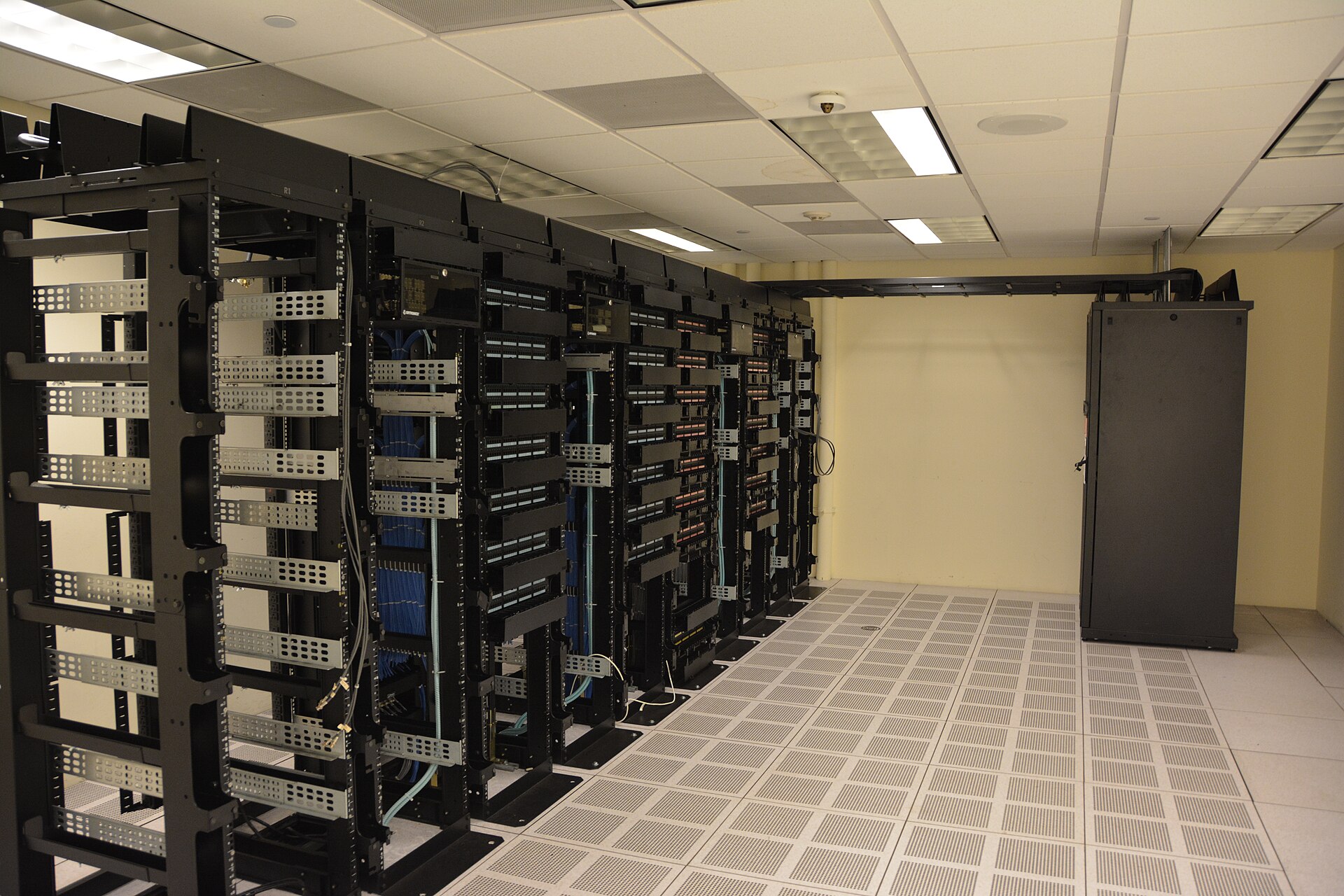 A datacenter server hall with rows of racks — the kind of Azure infrastructure powering Foundry and the agent platform